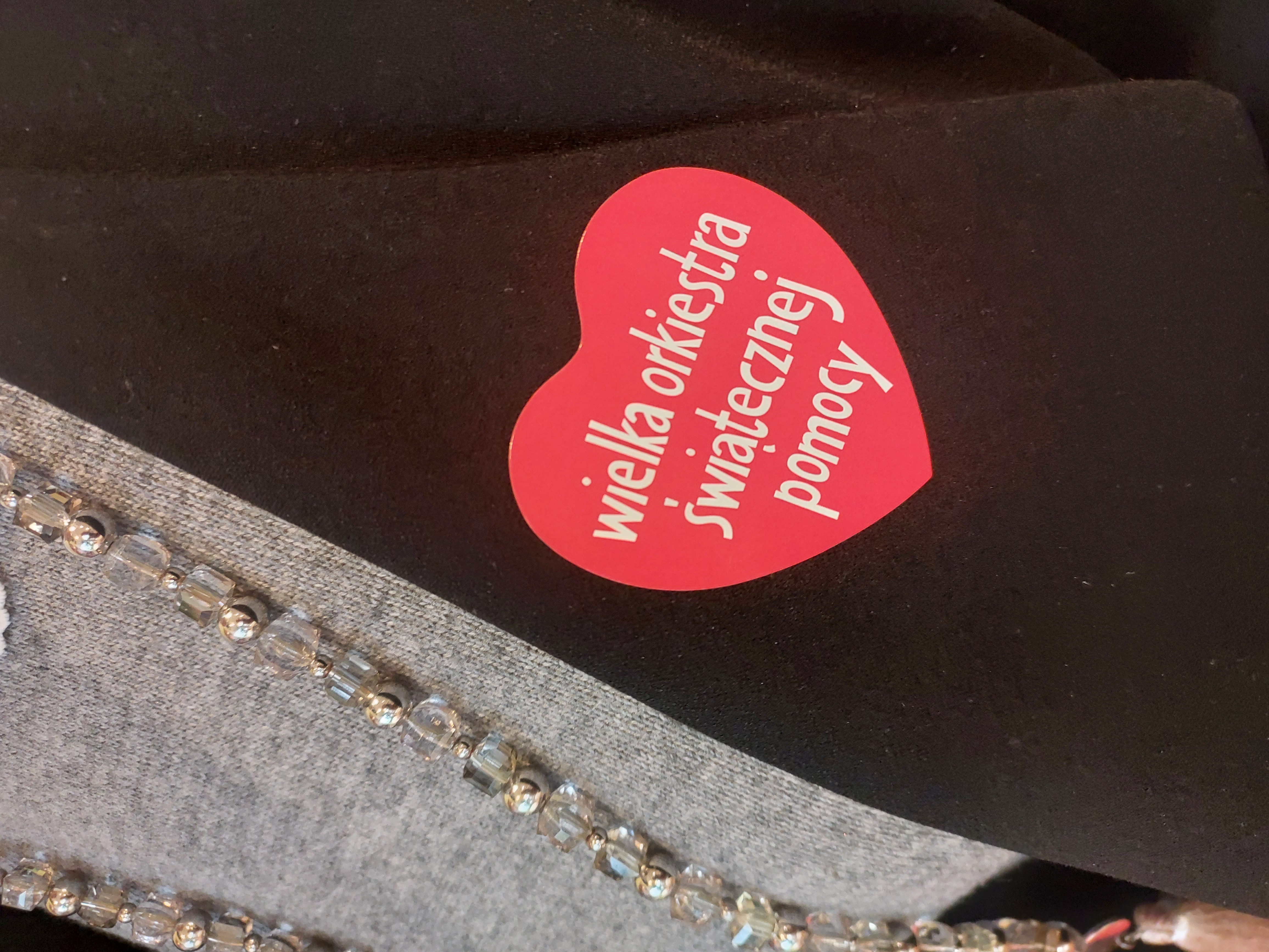 Red heart - sticker, given to the person who threw a donation into the can