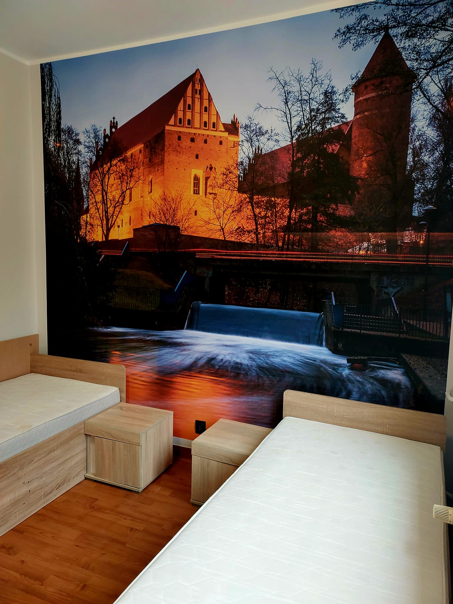 New wallpaper in the Hostel on Kosciuszko Street showing an image of the Olsztyn castle.
