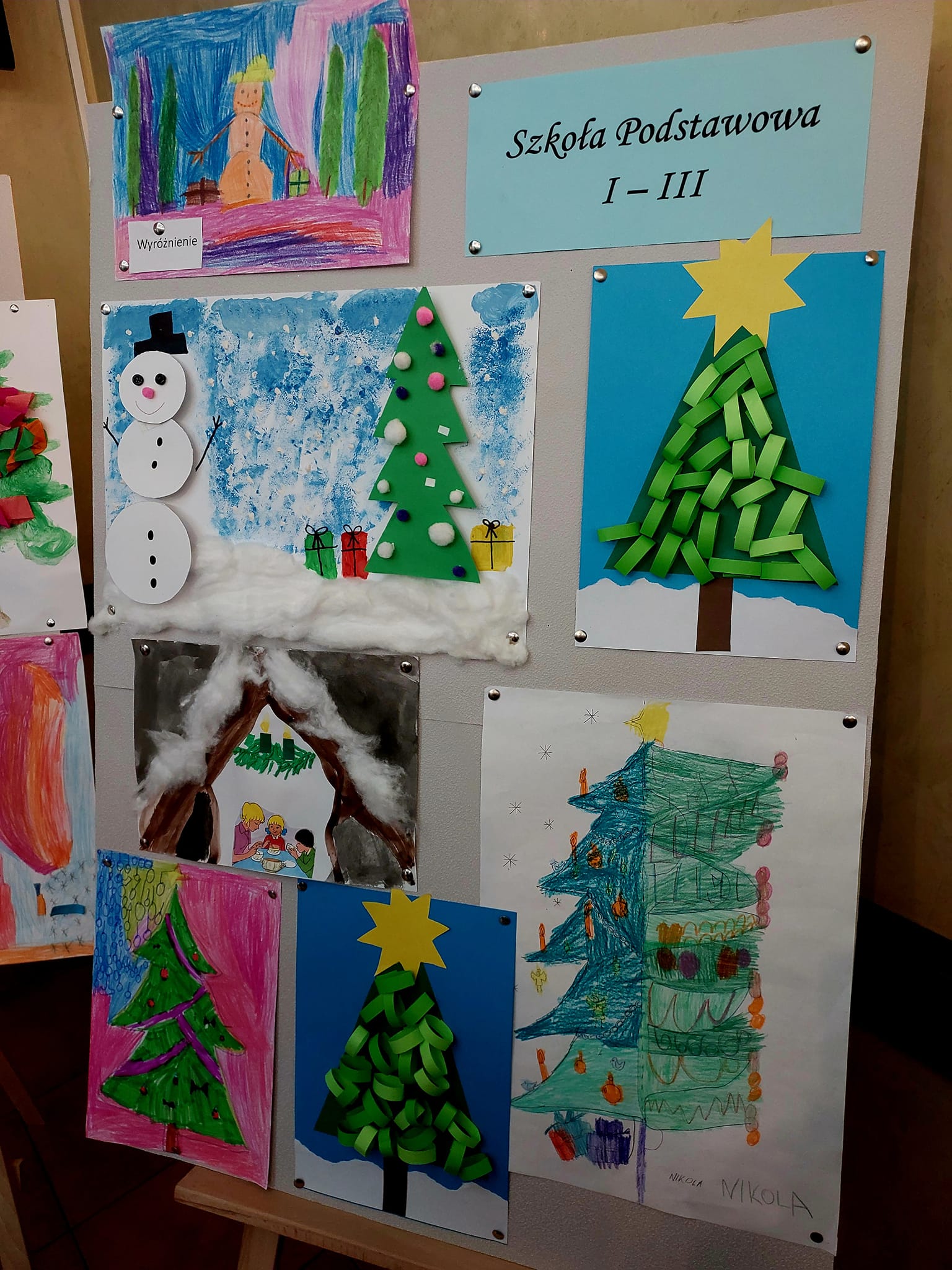   Presented on the easel are works in the elementary school category I - III, participating in the art contest 